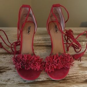 Red tassel heels
